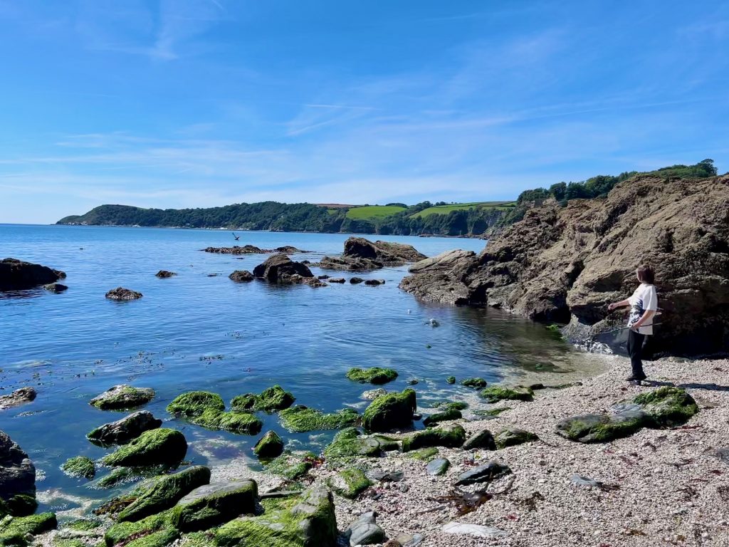 Skimming stones on Charlestown beach